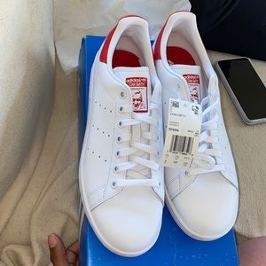 Never worn,White and red Stan Smith Adidas sneakers.